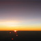 地平線に沈む夕日～上空